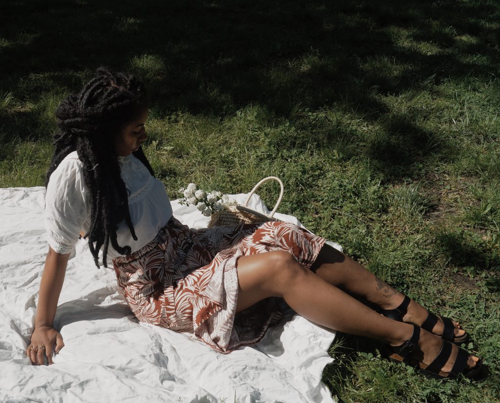 black girl with flowers in park ethereal floral photography vsco primark outfit blogger editorial nyc fashion style blog